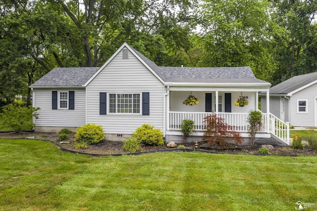 7768 Summerfield Rd, Lambertville, MI 48144 - single story home with covered porch, roof with shingles, a front lawn, and view of scattered trees
