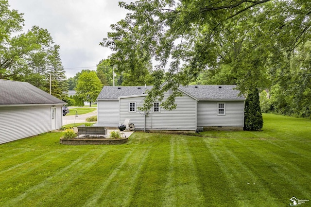 7768 Summerfield Rd, Lambertville, MI 48144 - rear view of property featuring a lawn and a patio area