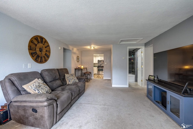 7768 Summerfield Rd, Lambertville, MI 48144 - living room with attic access, light colored carpet, and a textured ceiling