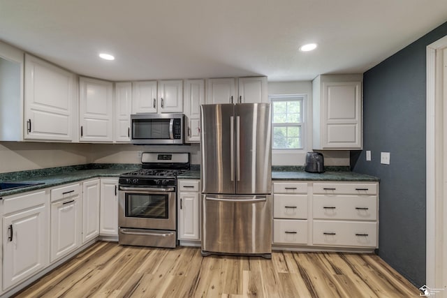 7768 Summerfield Rd, Lambertville, MI 48144 - kitchen with stainless steel appliances, white cabinetry, light wood-type flooring, and recessed lighting