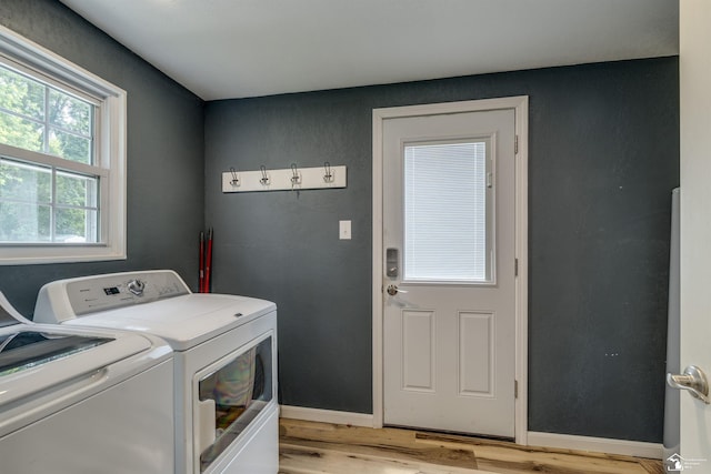 7768 Summerfield Rd, Lambertville, MI 48144 - laundry area featuring independent washer and dryer and light wood finished floors