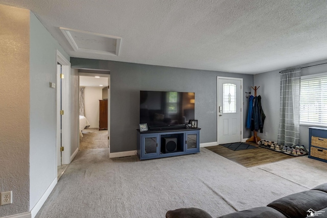 7768 Summerfield Rd, Lambertville, MI 48144 - living area with carpet flooring, healthy amount of natural light, attic access, and a textured ceiling