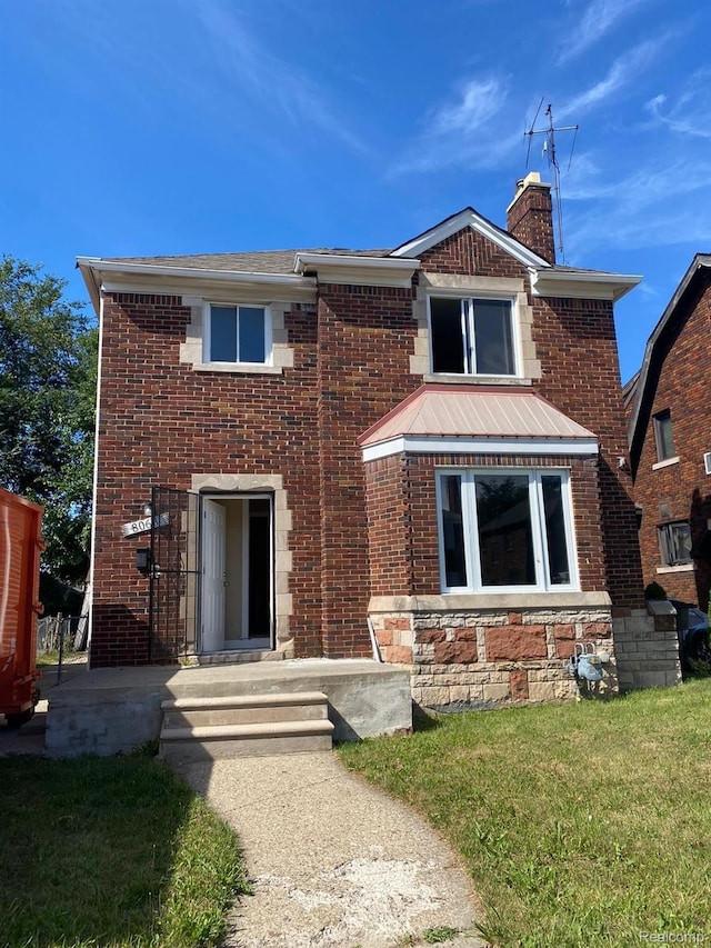 8063 Yolanda St, Detroit, MI 48234 - view of front of house featuring a chimney, brick siding, and a front lawn