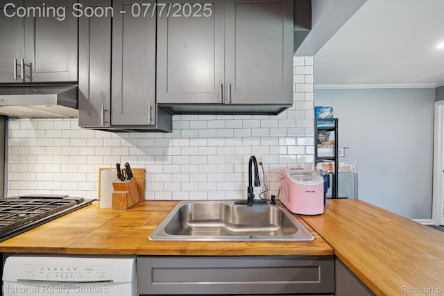 4714 Monterey Ave, Clarkston, MI 48348 - kitchen with wooden counters, wall chimney range hood, white dishwasher, gray cabinetry, and ornamental molding