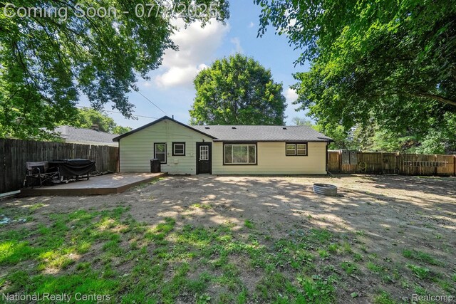 4714 Monterey Ave, Clarkston, MI 48348 - back of house featuring a deck and a fenced backyard