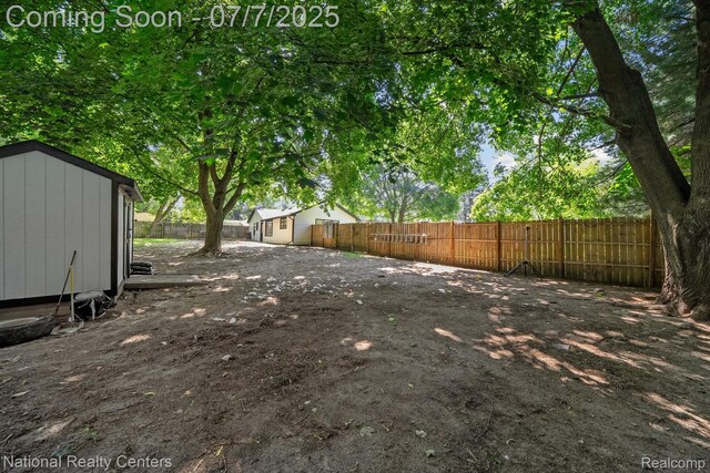 4714 Monterey Ave, Clarkston, MI 48348 - fenced backyard with a storage unit