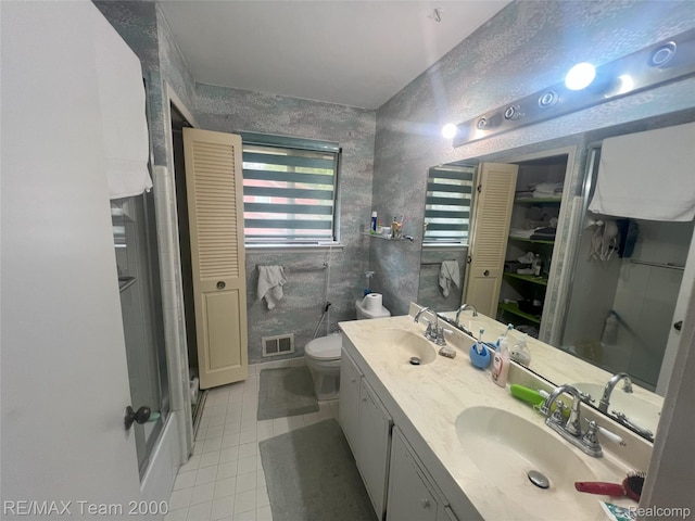 29203 Lake Park Dr, Farmington Hills, MI 48331 - bathroom featuring a closet, tile patterned floors, double vanity, and a shower with door