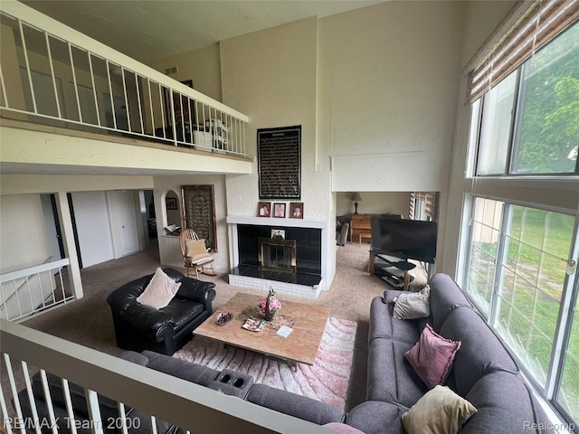 29203 Lake Park Dr, Farmington Hills, MI 48331 - living room with carpet flooring, a brick fireplace, and a towering ceiling
