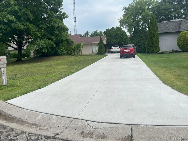 29203 Lake Park Dr, Farmington Hills, MI 48331 - view of front facade with driveway and a front lawn