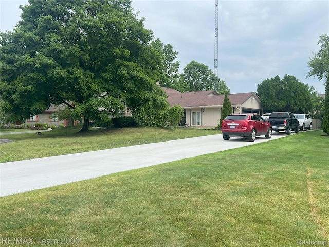29203 Lake Park Dr, Farmington Hills, MI 48331 - view of front of property with concrete driveway and a front yard