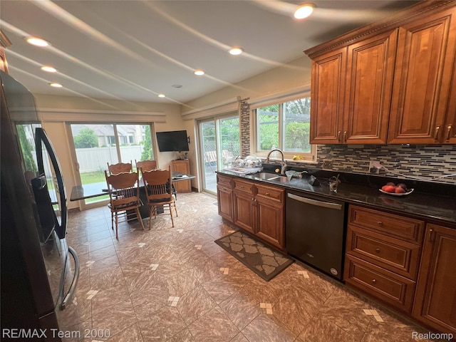 29203 Lake Park Dr, Farmington Hills, MI 48331 - kitchen featuring dishwasher, fridge with ice dispenser, plenty of natural light, vaulted ceiling, and tasteful backsplash
