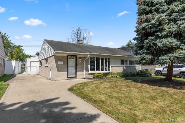 25615 Miracle Dr, Madison Heights, MI 48071 - view of front of property with a gate, brick siding, driveway, a chimney, and a detached garage