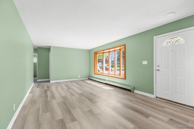 25615 Miracle Dr, Madison Heights, MI 48071 - foyer with baseboard heating and light wood-style flooring