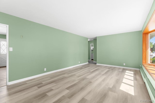 25615 Miracle Dr, Madison Heights, MI 48071 - spare room featuring a baseboard radiator and light wood finished floors