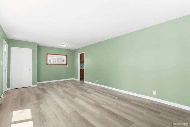 25615 Miracle Dr, Madison Heights, MI 48071 - empty room featuring light wood-style floors and baseboards
