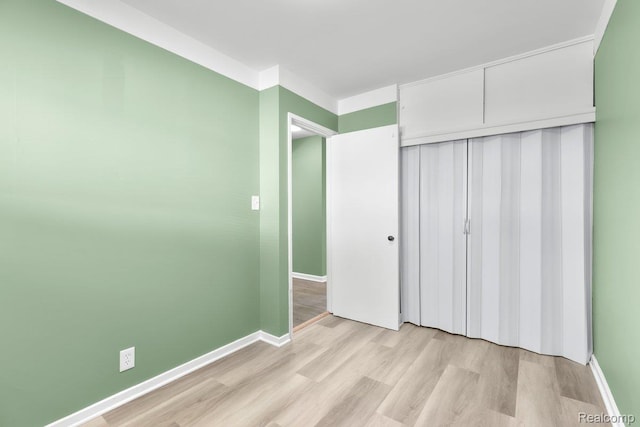 25615 Miracle Dr, Madison Heights, MI 48071 - unfurnished bedroom with light wood-style flooring and a closet