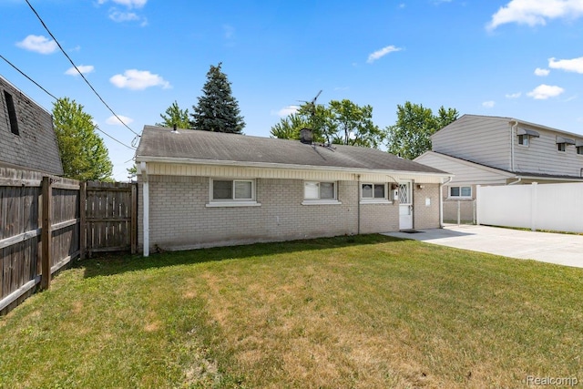 25615 Miracle Dr, Madison Heights, MI 48071 - rear view of property with brick siding, a fenced backyard, a patio area, and a shingled roof