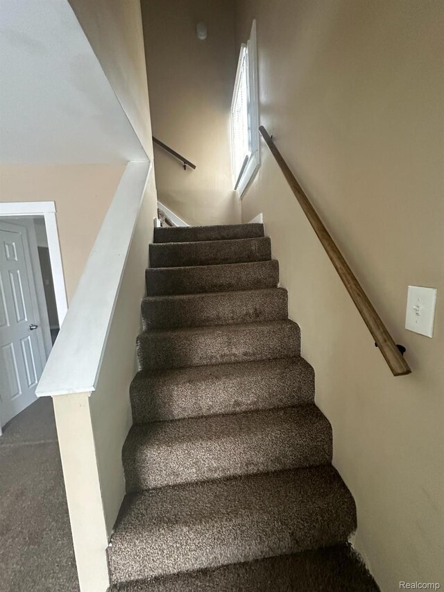 5030 Hereford St, Detroit, MI 48224 - stairway featuring carpet floors