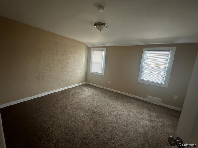 5030 Hereford St, Detroit, MI 48224 - empty room featuring carpet floors and a smoke detector