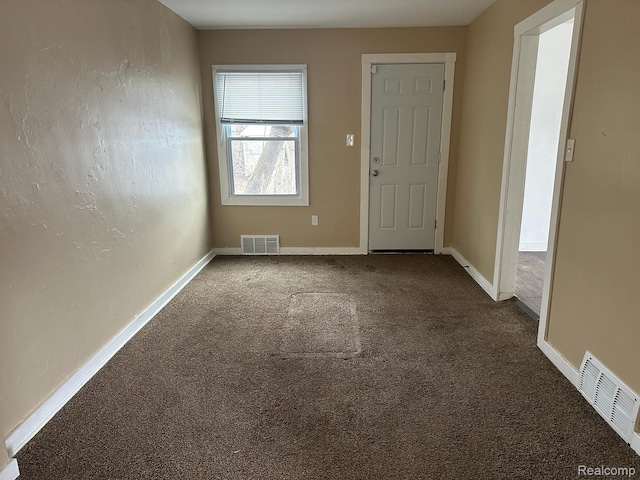 5030 Hereford St, Detroit, MI 48224 - foyer with dark carpet and baseboards