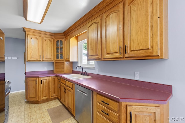 4100 Hunt Rd, Adrian, MI 49221 - kitchen featuring stainless steel dishwasher, light floors, glass insert cabinets, dark countertops, and stove