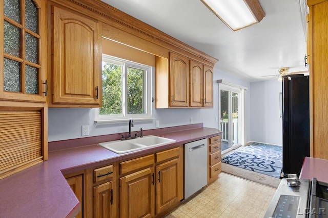 4100 Hunt Rd, Adrian, MI 49221 - kitchen with stainless steel dishwasher, freestanding refrigerator, glass insert cabinets, light floors, and a ceiling fan