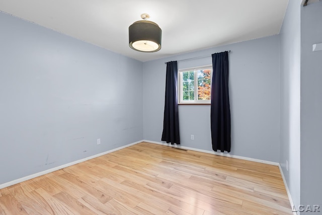 4100 Hunt Rd, Adrian, MI 49221 - empty room with wood finished floors and baseboards