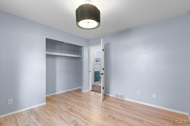 4100 Hunt Rd, Adrian, MI 49221 - unfurnished bedroom with a closet and wood finished floors