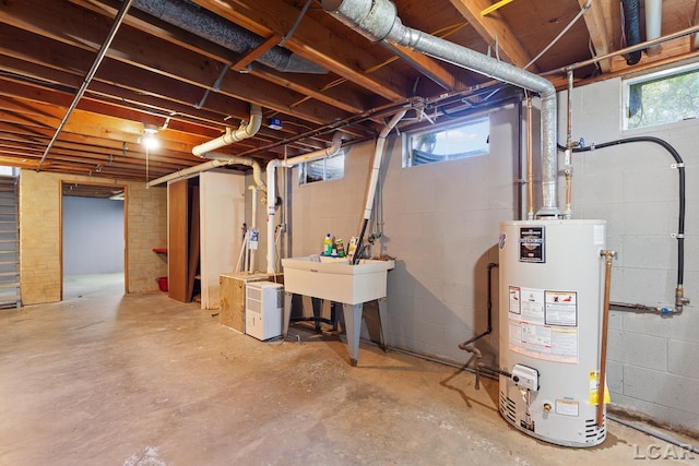 4100 Hunt Rd, Adrian, MI 49221 - below grade area featuring water heater and healthy amount of natural light
