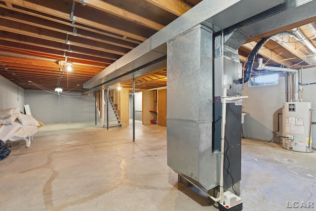4100 Hunt Rd, Adrian, MI 49221 - basement featuring gas water heater, heating unit, and stairs