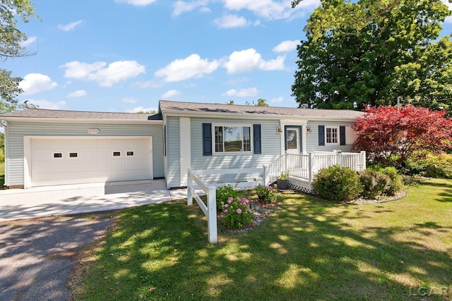 4100 Hunt Rd, Adrian, MI 49221 - single story home with driveway, a front yard, and a garage