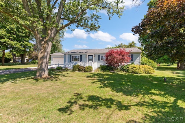 4100 Hunt Rd, Adrian, MI 49221 - single story home featuring a garage and a front lawn