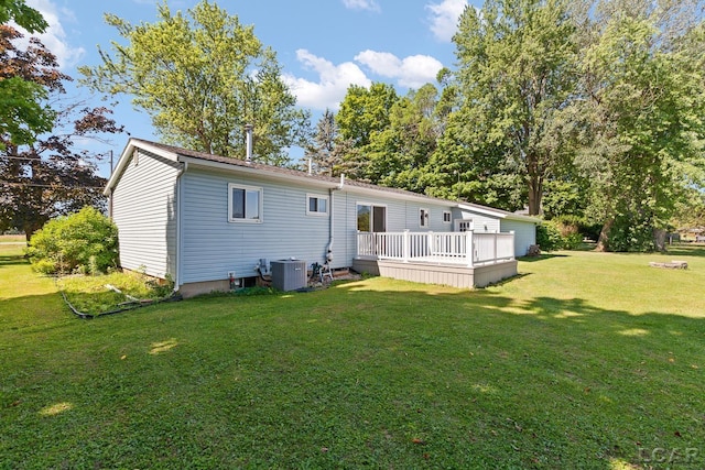 4100 Hunt Rd, Adrian, MI 49221 - rear view of house featuring a wooden deck and a yard