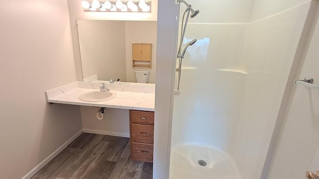 4763 Weston Ave, Kalamazoo, MI 49006 - full bathroom with a shower stall, wood finished floors, and vanity