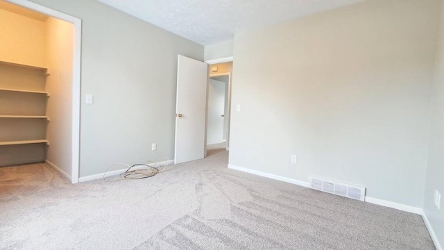 4763 Weston Ave, Kalamazoo, MI 49006 - unfurnished bedroom featuring carpet and a walk in closet