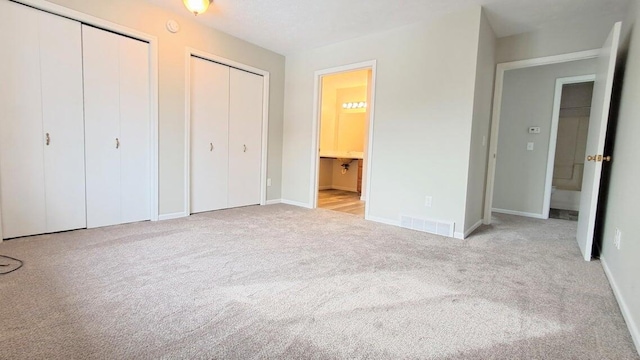 4763 Weston Ave, Kalamazoo, MI 49006 - unfurnished bedroom with multiple closets, carpet, and ensuite bath