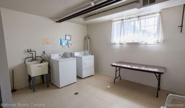8160 Crestview Dr, Sterling Heights, MI 48312 - laundry area featuring washing machine and dryer and light flooring