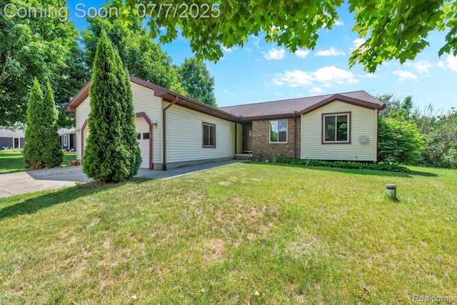 3447 Woodvalley Dr, Lapeer, MI 48446 - ranch-style house featuring a garage, a front yard, and driveway