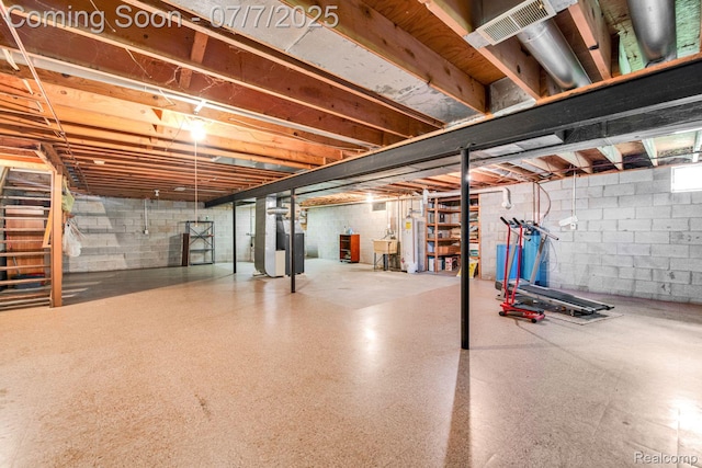3447 Woodvalley Dr, Lapeer, MI 48446 - unfinished basement featuring water heater and heating unit
