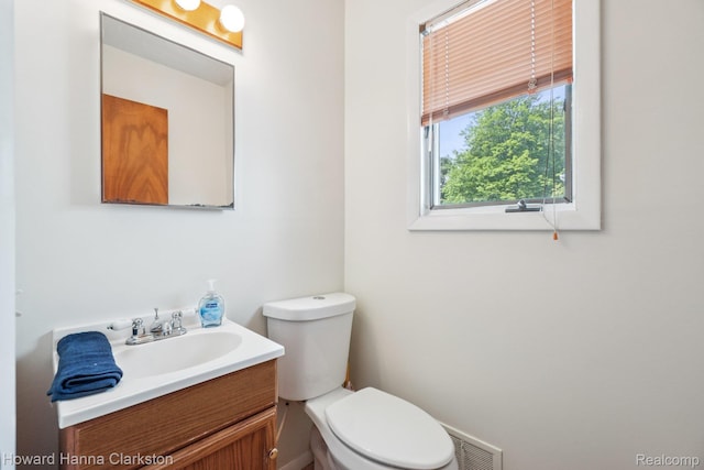 4220 England Beach Rd, White Lake, MI 48383 - half bathroom with toilet and vanity