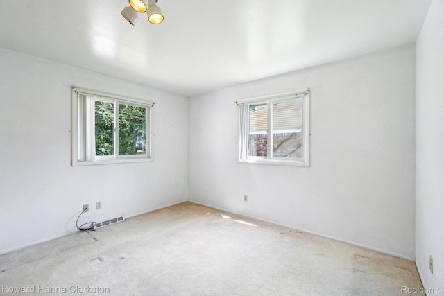 4220 England Beach Rd, White Lake, MI 48383 - unfurnished room featuring healthy amount of natural light and carpet