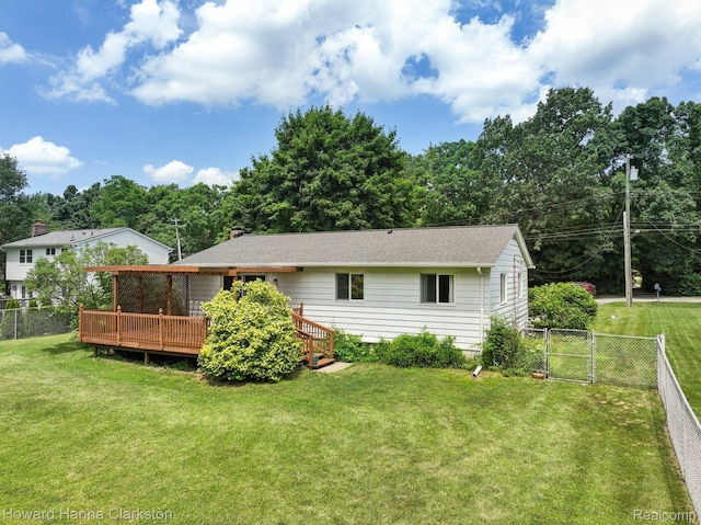 4220 England Beach Rd, White Lake, MI 48383 - back of property featuring a wooden deck, a fenced backyard, and a gate