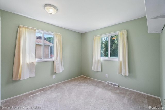 4220 England Beach Rd, White Lake, MI 48383 - carpeted spare room featuring baseboards