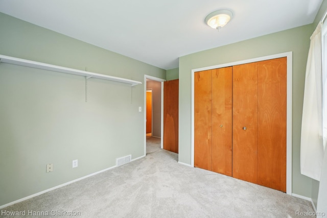 4220 England Beach Rd, White Lake, MI 48383 - unfurnished bedroom with carpet floors and a closet