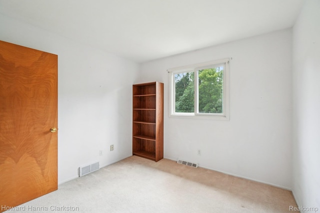4220 England Beach Rd, White Lake, MI 48383 - spare room featuring carpet floors