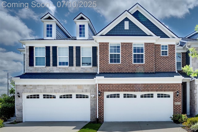 43433 Chancellor Ln, Novi, MI 48375 - view of front facade featuring concrete driveway, a garage, and stone siding
