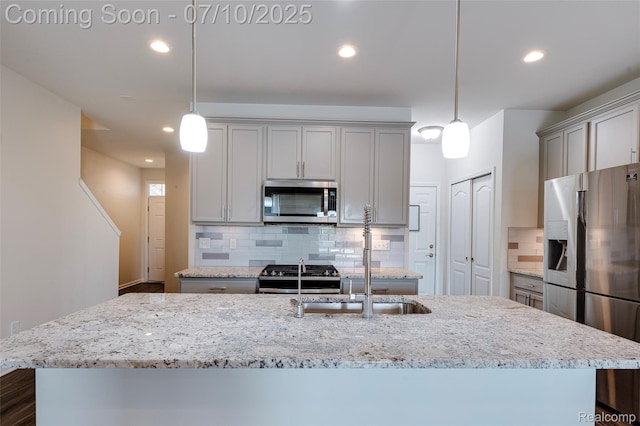 43433 Chancellor Ln, Novi, MI 48375 - kitchen with appliances with stainless steel finishes, recessed lighting, gray cabinets, a center island with sink, and decorative backsplash