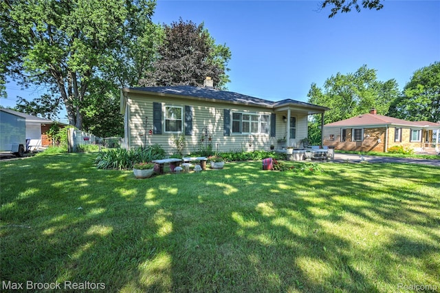 2233 Kohler St, Waterford, MI 48329 - view of front of property featuring a front lawn and a chimney