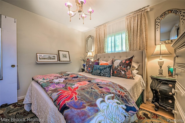 2233 Kohler St, Waterford, MI 48329 - bedroom with a chandelier and wood finished floors