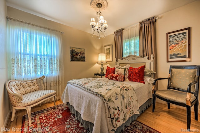 2233 Kohler St, Waterford, MI 48329 - bedroom with wood finished floors and a chandelier